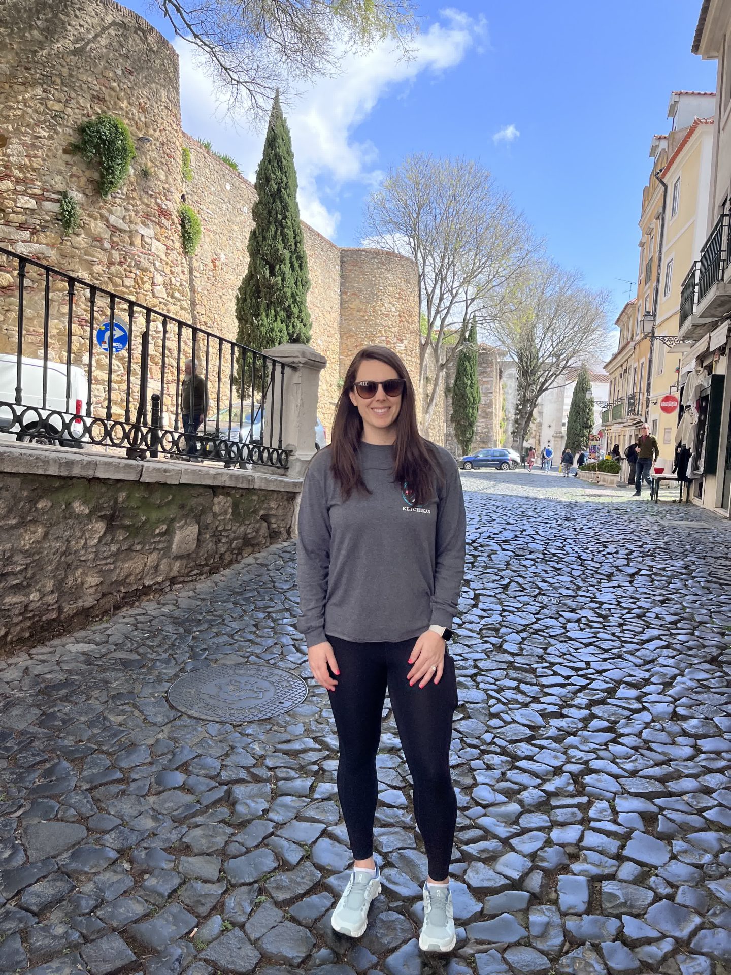 Steep cobblestone street in an old Lisbon neighborhood